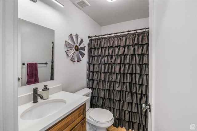 591 S Lakeside Dr, Franklin, ID 83237 - bathroom with vanity, toilet, curtained shower, and visible vents