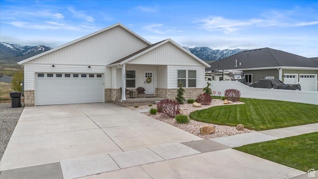 591 S Lakeside Dr, Franklin, ID 83237 - ranch-style house with covered porch, a mountain view, and stone siding