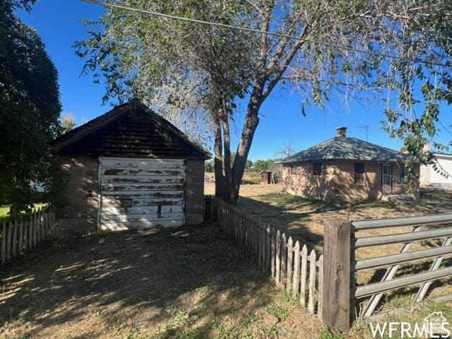 390 W Sandy Ln, Salina, UT 84654 - exterior space featuring a garage, fence, and an outbuilding