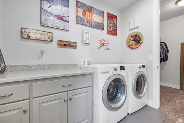 1677 W Escapes Dr Unit 103, St George, UT 84770 - laundry room featuring cabinet space, baseboards, washer and clothes dryer, and carpet
