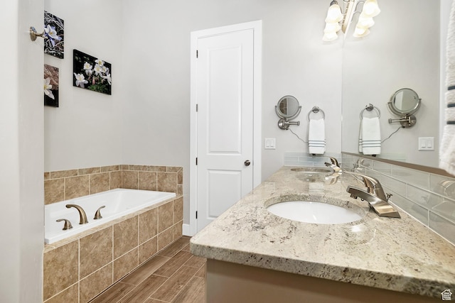 1677 W Escapes Dr Unit 103, St George, UT 84770 - full bath with a garden tub, a sink, a notable chandelier, and double vanity