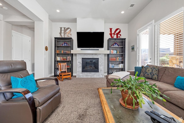1677 W Escapes Dr Unit 103, St George, UT 84770 - carpeted living room with recessed lighting, baseboards, a glass covered fireplace, and visible vents