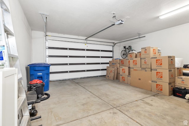 1677 W Escapes Dr Unit 103, St George, UT 84770 - garage featuring a garage door opener