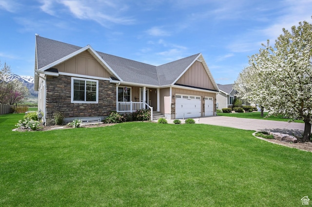 633 N 800 E, Wellsville, UT 84339 - craftsman-style home featuring board and batten siding, roof with shingles, covered porch, and stone siding