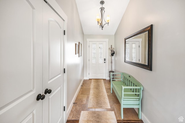 633 N 800 E, Wellsville, UT 84339 - doorway to outside with baseboards, a chandelier, and stone finish floor