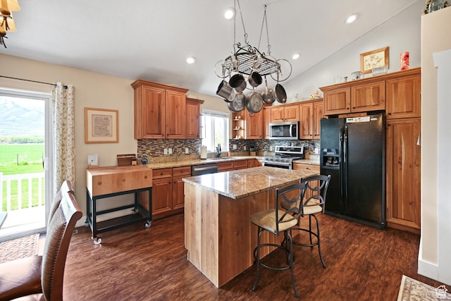 633 N 800 E, Wellsville, UT 84339 - kitchen featuring dark wood-style flooring, stainless steel appliances, a sink, and backsplash
