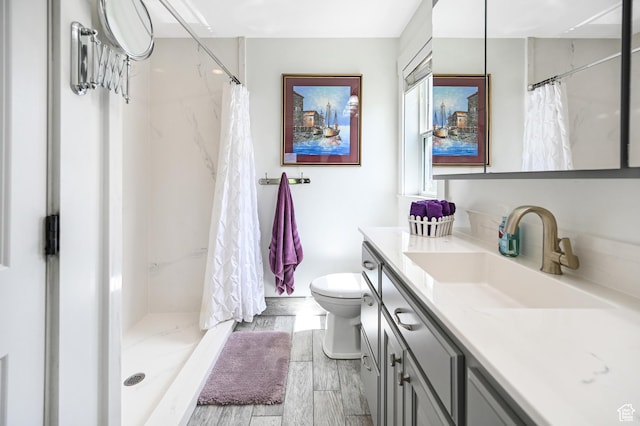 633 N 800 E, Wellsville, UT 84339 - bathroom featuring vanity, toilet, wood finished floors, and a stall shower