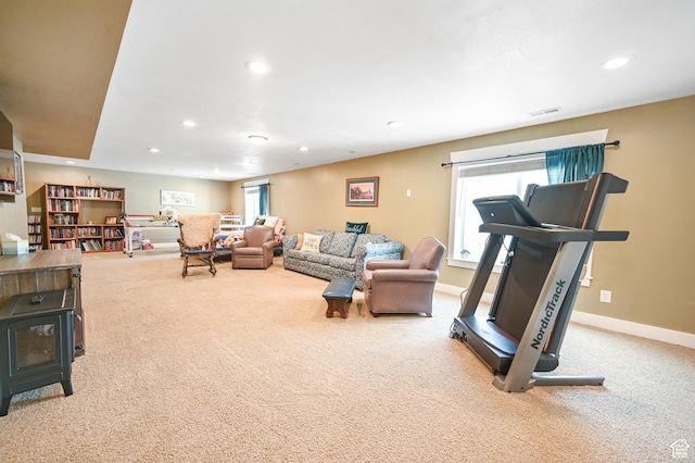 633 N 800 E, Wellsville, UT 84339 - carpeted living room featuring visible vents, recessed lighting, baseboards, and a wood stove