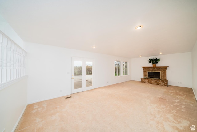 1720 N 1850 E, North Logan, UT 84341 - unfurnished living room with a brick fireplace, recessed lighting, light colored carpet, and visible vents