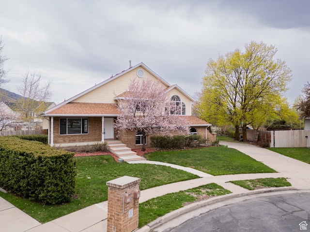 1720 N 1850 E, North Logan, UT 84341 - bungalow-style home with brick siding, fence, driveway, and a front yard