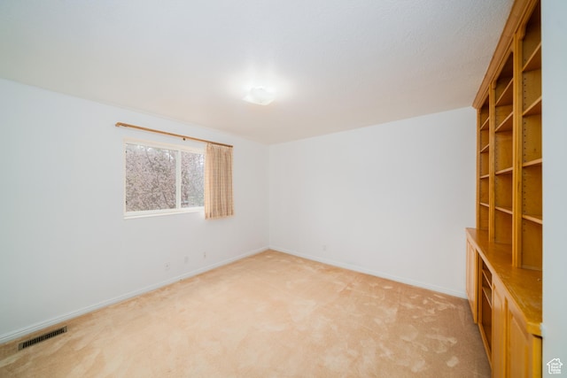 1720 N 1850 E, North Logan, UT 84341 - spare room featuring baseboards, light carpet, and visible vents