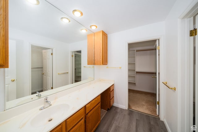 1720 N 1850 E, North Logan, UT 84341 - bathroom with vanity, baseboards, wood finished floors, and a spacious closet