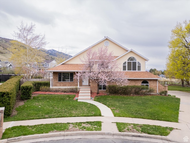 1720 N 1850 E, North Logan, UT 84341 - view of front of property with fence, a front lawn, and brick siding