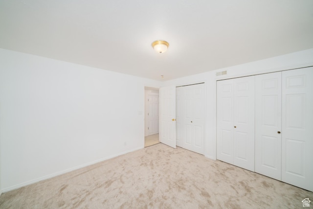 1720 N 1850 E, North Logan, UT 84341 - unfurnished bedroom with baseboards, carpet, two closets, and visible vents