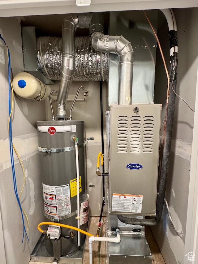utilities featuring heating unit and strapped water heater