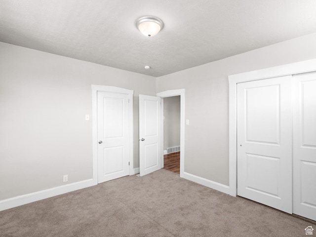 3084 W 3875 S, West Valley City, UT 84119 - unfurnished bedroom featuring baseboards, carpet, a closet, and visible vents