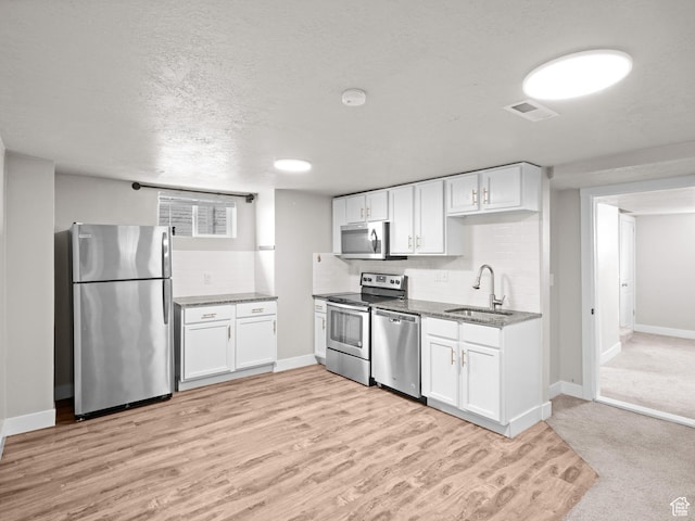 3084 W 3875 S, West Valley City, UT 84119 - kitchen with white cabinets, appliances with stainless steel finishes, and a sink