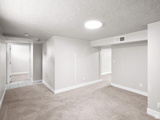 3084 W 3875 S, West Valley City, UT 84119 - finished basement featuring a textured ceiling, visible vents, baseboards, and carpet