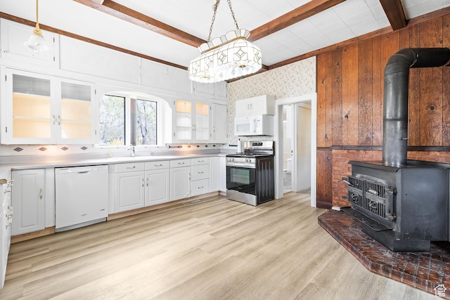 394 W 100 N, Mount Pleasant, UT 84647 - kitchen with light countertops, beam ceiling, white cabinets, and white appliances