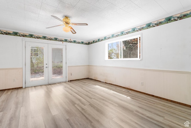 394 W 100 N, Mount Pleasant, UT 84647 - spare room with french doors, a ceiling fan, wainscoting, and wood finished floors