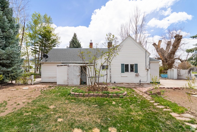 394 W 100 N, Mount Pleasant, UT 84647 - rear view of house featuring a lawn, a patio, and a chimney