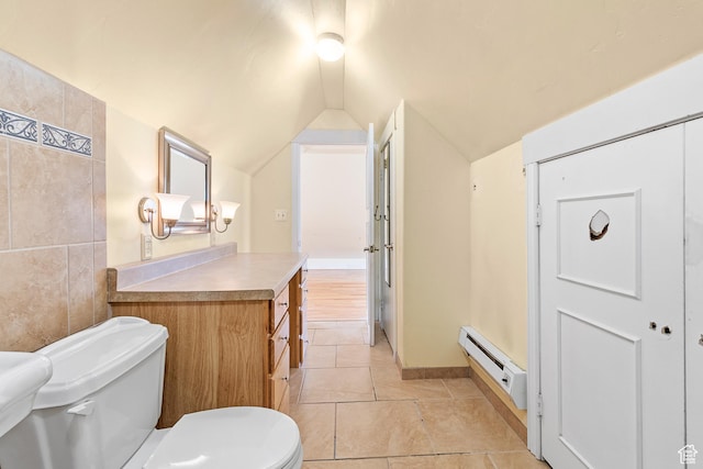 394 W 100 N, Mount Pleasant, UT 84647 - bathroom with vanity, lofted ceiling, toilet, baseboard heating, and tile patterned floors