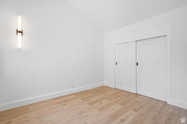 4758 S Ichabod St, Holladay, UT 84117 - unfurnished bedroom featuring light wood-type flooring, vaulted ceiling, and a closet