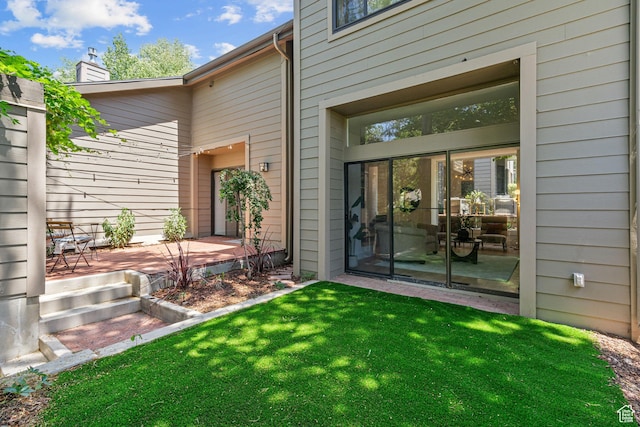 4758 S Ichabod St, Holladay, UT 84117 - property entrance with a chimney and a lawn