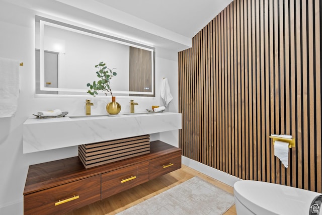 4758 S Ichabod St, Holladay, UT 84117 - bathroom featuring vanity, wallpapered walls, and wood finished floors