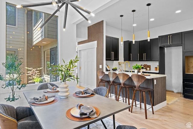 4758 S Ichabod St, Holladay, UT 84117 - dining room featuring light wood-style floors, a high ceiling, and ceiling fan