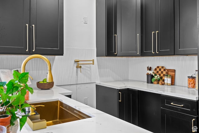 4758 S Ichabod St, Holladay, UT 84117 - kitchen featuring dark cabinets and light stone countertops