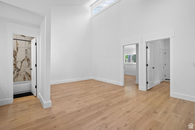 4758 S Ichabod St, Holladay, UT 84117 - unfurnished bedroom with a high ceiling and light wood-type flooring