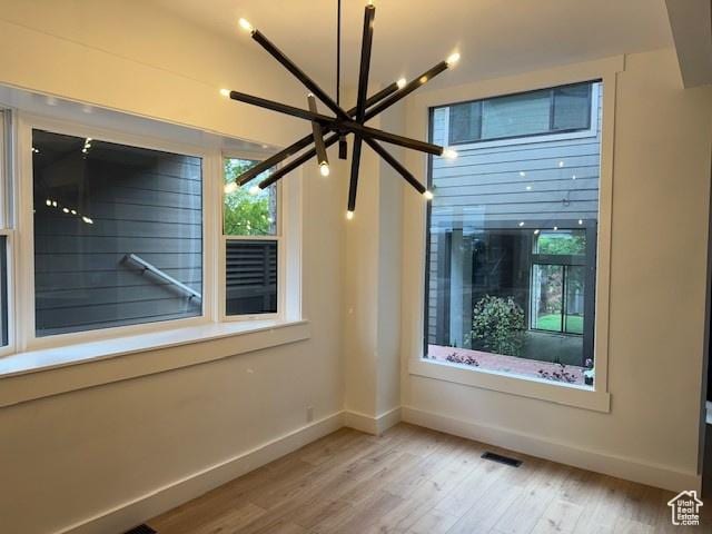 4758 S Ichabod St, Holladay, UT 84117 - spare room with baseboards, visible vents, a wealth of natural light, and light wood finished floors