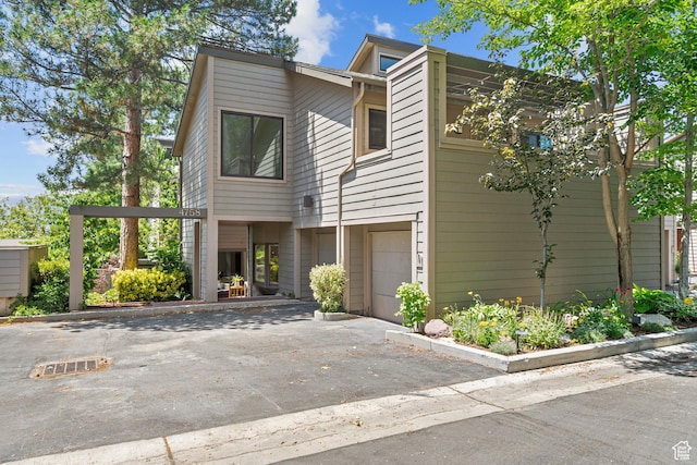 4758 S Ichabod St, Holladay, UT 84117 - view of front of home with an attached garage and driveway