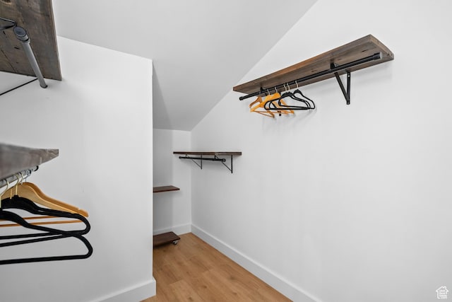 4758 S Ichabod St, Holladay, UT 84117 - spacious closet featuring light wood finished floors and vaulted ceiling