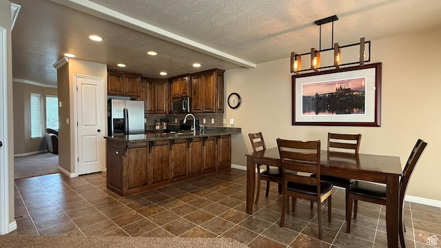 1069 N Independence Ave, Provo, UT 84604 - kitchen featuring stainless steel appliances, a peninsula, baseboards, recessed lighting, and tasteful backsplash