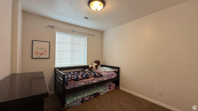 1069 N Independence Ave, Provo, UT 84604 - bedroom with a textured ceiling, baseboards, and carpet