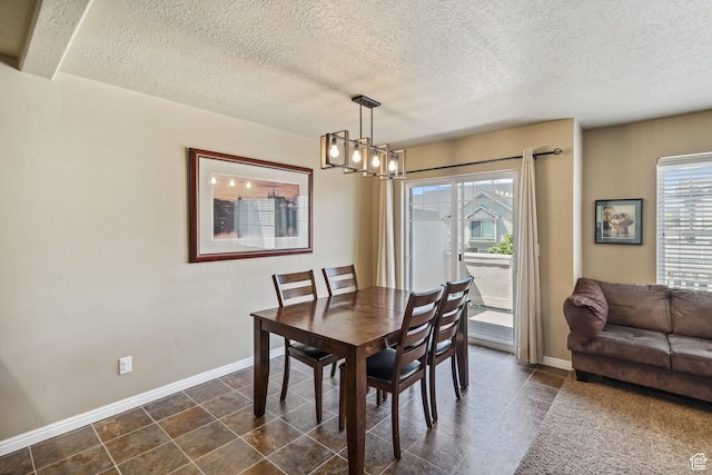 1069 N Independence Ave, Provo, UT 84604 - dining area with a chandelier, baseboards, and a textured ceiling