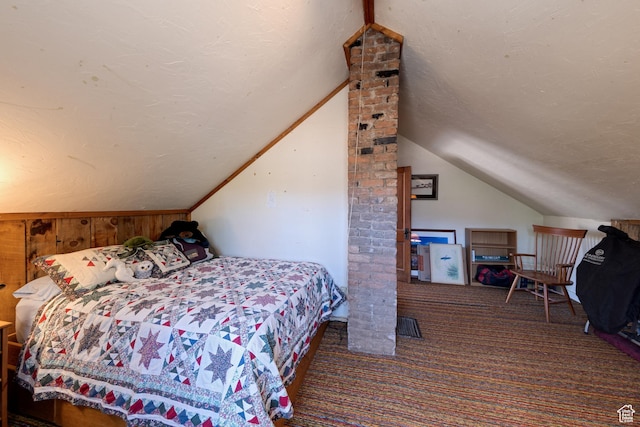 210 S 400 E, Moab, UT 84532 - bedroom with carpet, a textured ceiling, lofted ceiling, and wood walls