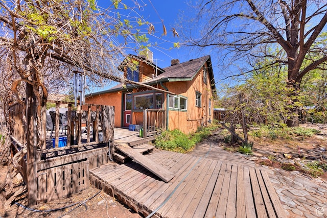 210 S 400 E, Moab, UT 84532 - back of property featuring a wooden deck and a chimney