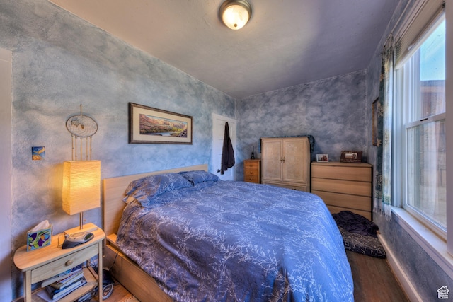 210 S 400 E, Moab, UT 84532 - bedroom featuring wood finished floors and multiple windows