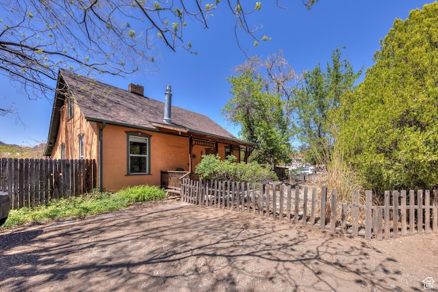 210 S 400 E, Moab, UT 84532 - view of front of house with a chimney and roof with shingles
