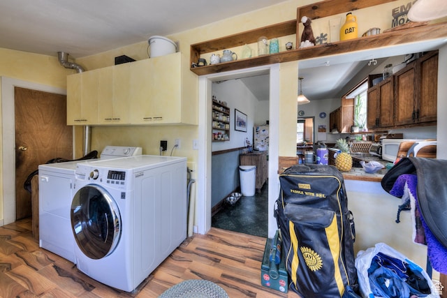210 S 400 E, Moab, UT 84532 - washroom featuring cabinet space, washer and clothes dryer, and light wood finished floors