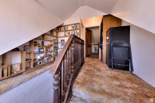 210 S 400 E, Moab, UT 84532 - corridor featuring built in shelves, carpet floors, vaulted ceiling, and an upstairs landing