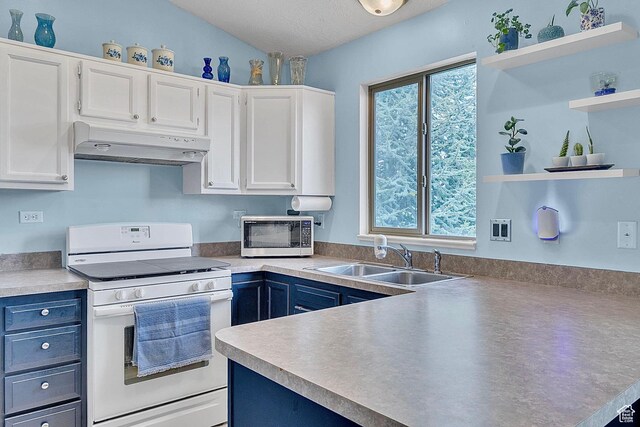 1976 N 1720 W, Clinton, UT 84015 - kitchen with white gas stove, open shelves, a sink, stainless steel microwave, and under cabinet range hood