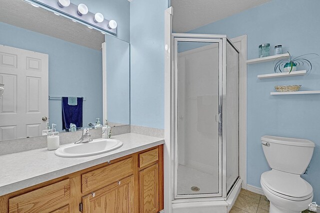 1976 N 1720 W, Clinton, UT 84015 - full bath with tile patterned flooring, vanity, toilet, a textured ceiling, and a shower stall