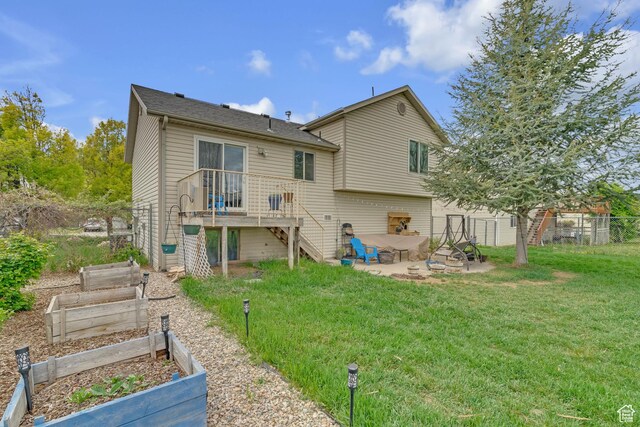 1976 N 1720 W, Clinton, UT 84015 - rear view of house featuring fence, a patio, a vegetable garden, a yard, and stairway