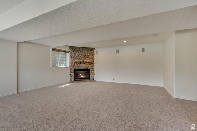 11362 Palisade View Dr, South Jordan, UT 84095 - unfurnished living room featuring baseboards, carpet flooring, recessed lighting, and a stone fireplace