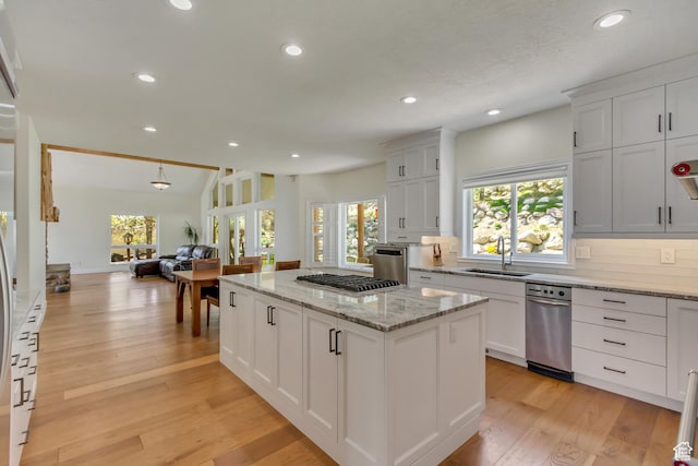 11362 Palisade View Dr, South Jordan, UT 84095 - kitchen featuring recessed lighting, open floor plan, a healthy amount of sunlight, and a sink