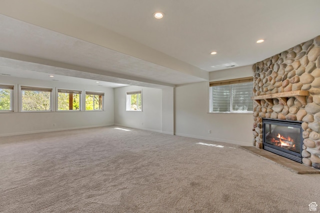 11362 Palisade View Dr, South Jordan, UT 84095 - unfurnished living room with recessed lighting, baseboards, a stone fireplace, and carpet